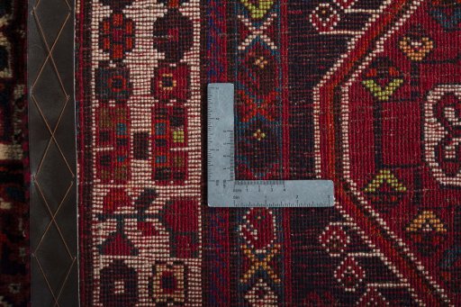 Surface texture of 2000s Shiraz rug with natural Wool and intricate pattern