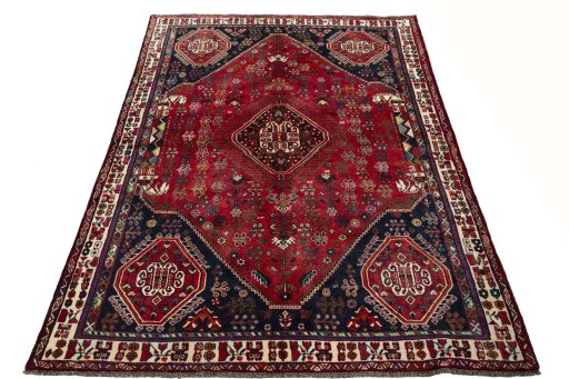 Surface texture of 2000s Shiraz rug with natural Wool and intricate pattern