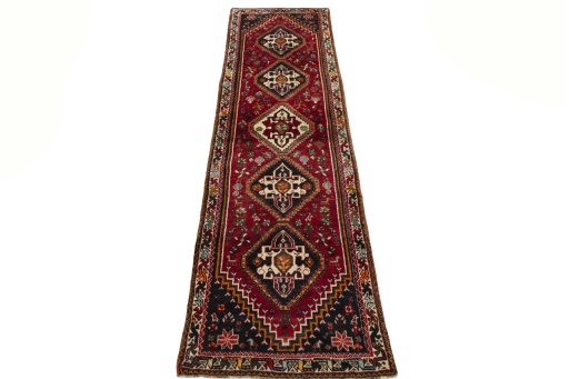 Surface texture of 2000s Shiraz rug with natural Wool and intricate pattern