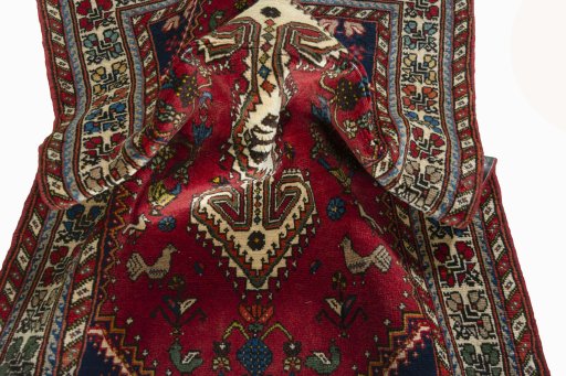 Corner detail of 2000s Shiraz rug showing border pattern and Wool pile
