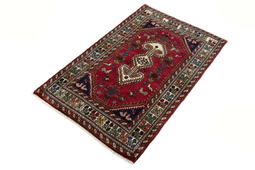 Corner detail of 2000s Shiraz rug showing border pattern and Wool pile