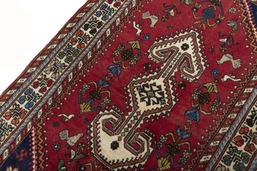 Backside of handmade 2000s Shiraz rug showing knot structure and weave density