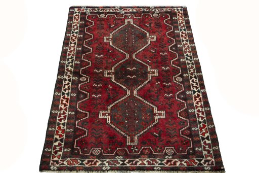 Surface texture of 2000s Shiraz rug with natural Wool and intricate pattern