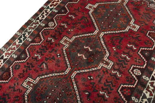 Backside of handmade 2000s Shiraz rug showing knot structure and weave density
