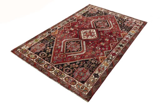 Corner detail of 2000s Shiraz rug showing border pattern and Wool pile