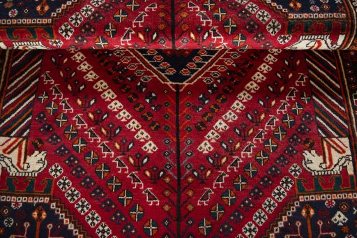 Corner detail of 2000s Shiraz rug showing border pattern and Wool pile