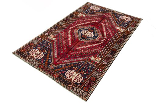 Corner detail of 2000s Shiraz rug showing border pattern and Wool pile