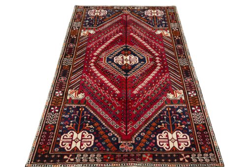 Surface texture of 2000s Shiraz rug with natural Wool and intricate pattern