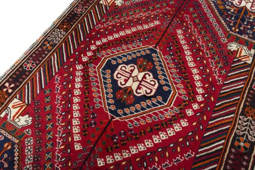 Backside of handmade 2000s Shiraz rug showing knot structure and weave density