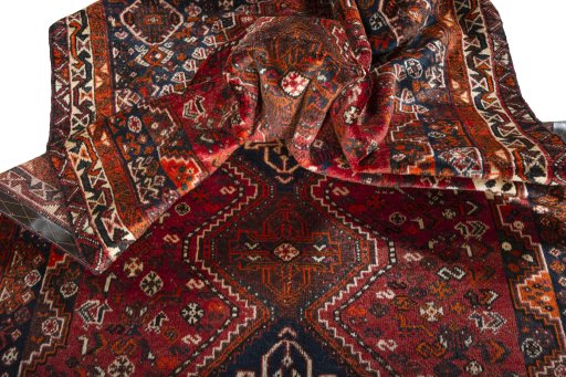 Corner detail of 1970s Shiraz rug showing border pattern and Wool pile