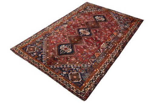 Corner detail of 1970s Shiraz rug showing border pattern and Wool pile