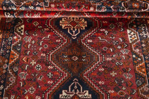 Full view of 1970s Shiraz rug from Iran / Persia, 265 × 175 cm in Red tones
