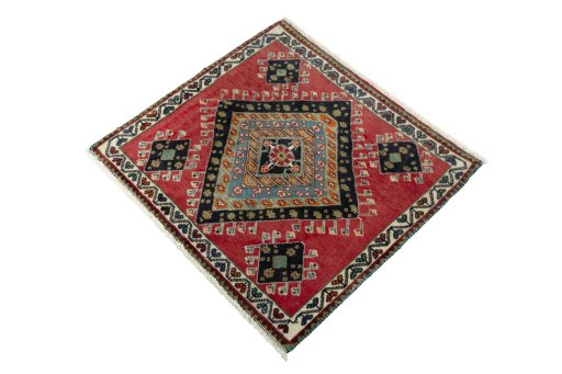 Corner detail of 2000s Shiraz rug showing border pattern and Wool pile