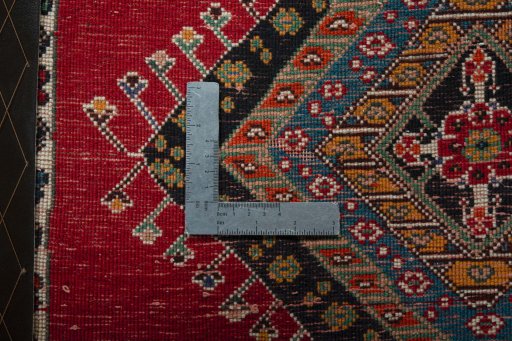 Backside of handmade 2000s Shiraz rug showing knot structure and weave density