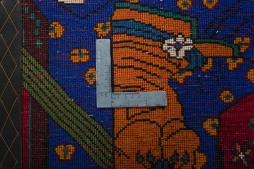 Backside of handmade 2000s Shiraz rug showing knot structure and weave density