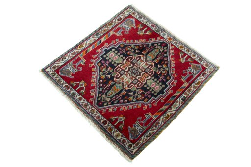 Corner detail of 2000s Shiraz rug showing border pattern and Wool pile