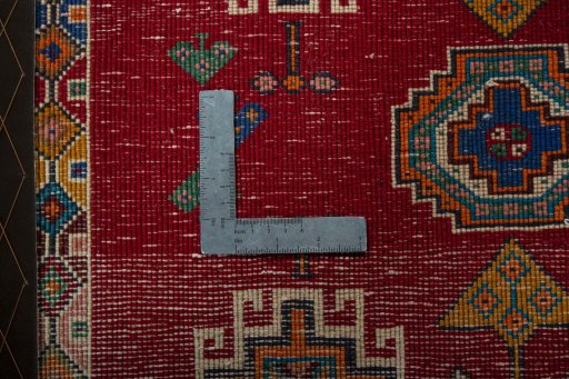 Backside of handmade 2000s Shiraz rug showing knot structure and weave density