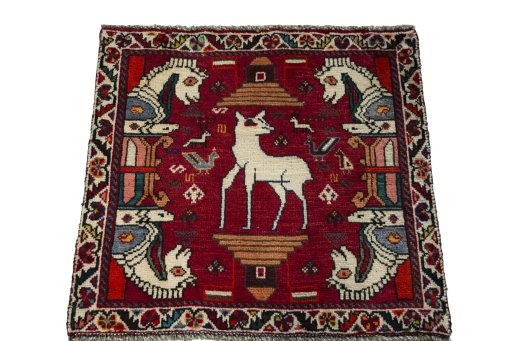 Surface texture of 2000s Shiraz rug with natural Wool and intricate pattern