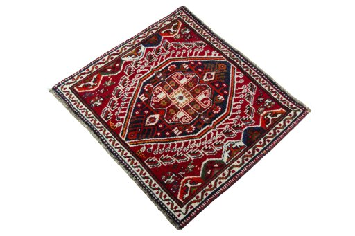 Corner detail of 2000s Shiraz rug showing border pattern and Wool pile