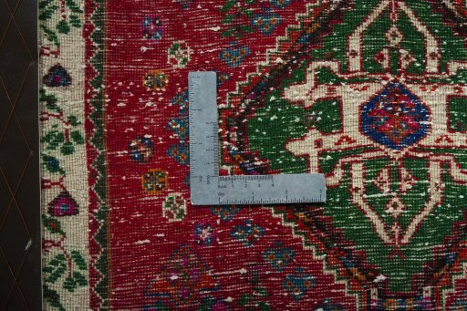 Backside of handmade 2000s Shiraz rug showing knot structure and weave density