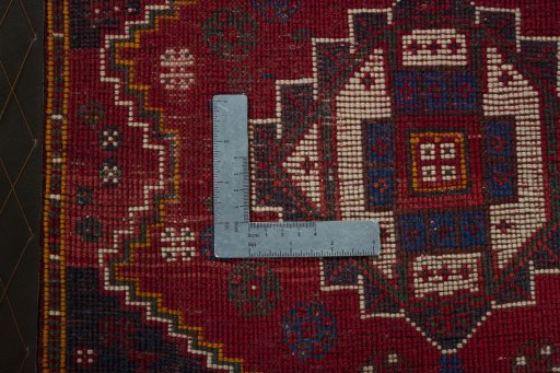 Backside of handmade 2000s Shiraz rug showing knot structure and weave density