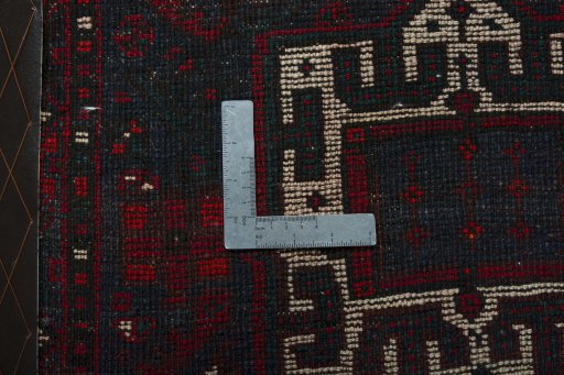 Backside of handmade 2000s Shiraz rug showing knot structure and weave density