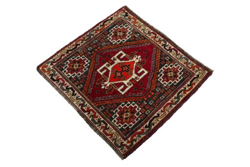 Corner detail of 2000s Shiraz rug showing border pattern and Wool pile