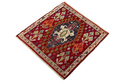 Corner detail of 2000s Shiraz rug showing border pattern and Wool pile