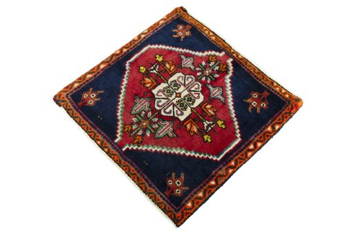 Corner detail of 2000s Shiraz rug showing border pattern and Wool pile