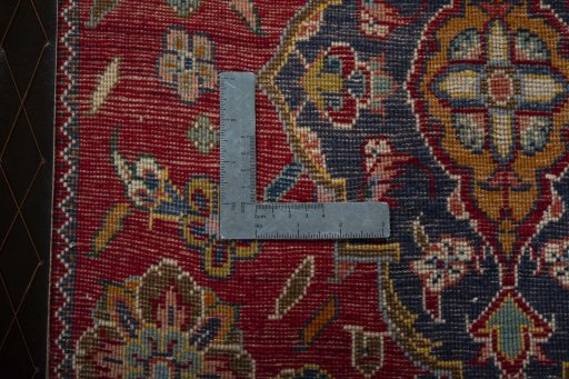 Backside of handmade 2000s Shiraz rug showing knot structure and weave density