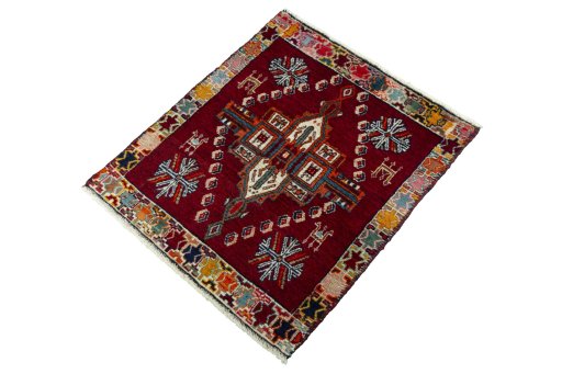 Corner detail of 2000s Shiraz rug showing border pattern and Wool pile