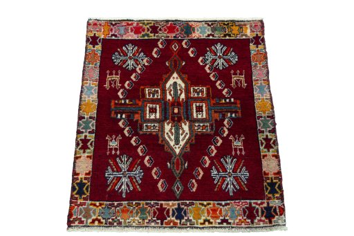 Surface texture of 2000s Shiraz rug with natural Wool and intricate pattern