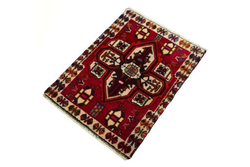 Corner detail of 2000s Shiraz rug showing border pattern and Wool pile