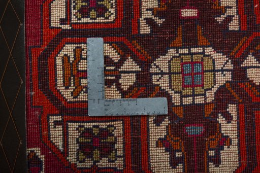 Backside of handmade 2000s Shiraz rug showing knot structure and weave density