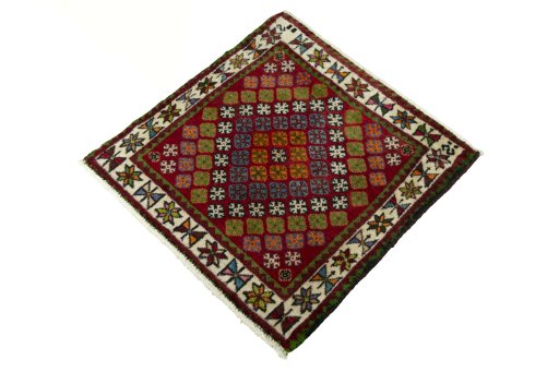 Corner detail of 2000s Shiraz rug showing border pattern and Wool pile