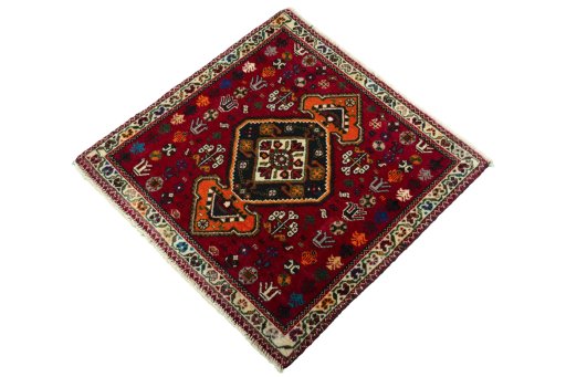 Corner detail of 2000s Shiraz rug showing border pattern and Wool pile