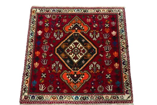 Surface texture of 2000s Shiraz rug with natural Wool and intricate pattern