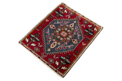 Corner detail of 2000s Shiraz rug showing border pattern and Wool pile
