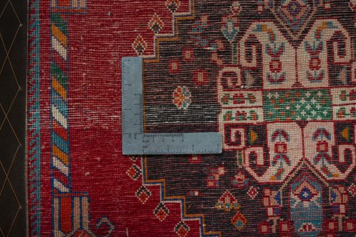 Backside of handmade 2000s Shiraz rug showing knot structure and weave density