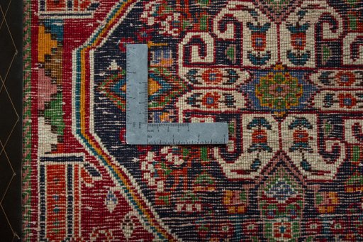 Backside of handmade 2000s Shiraz rug showing knot structure and weave density
