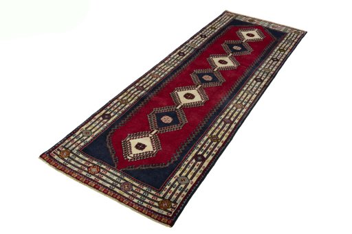 Corner detail of 2000s Shiraz rug showing border pattern and Wool pile
