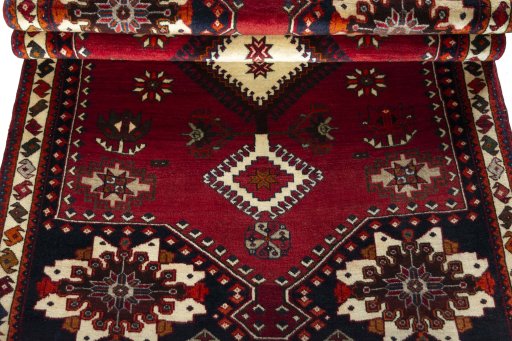 Corner detail of 2000s Shiraz rug showing border pattern and Wool pile