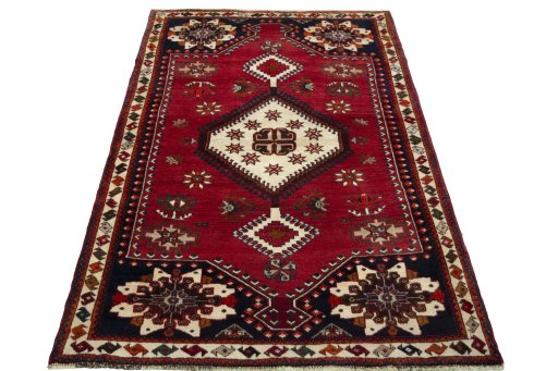 Surface texture of 2000s Shiraz rug with natural Wool and intricate pattern
