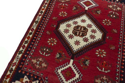 Backside of handmade 2000s Shiraz rug showing knot structure and weave density