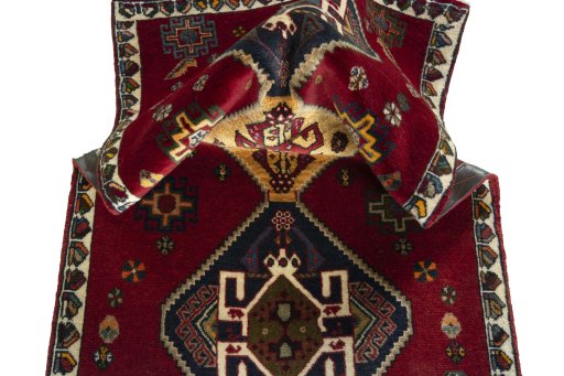 Corner detail of 2000s Shiraz rug showing border pattern and Wool pile