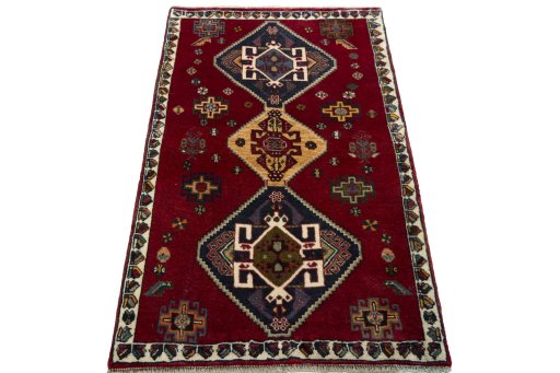 Surface texture of 2000s Shiraz rug with natural Wool and intricate pattern