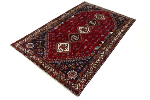 Corner detail of 2000s Shiraz rug showing border pattern and Wool pile
