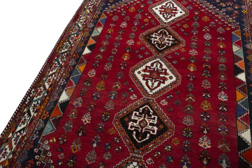Backside of handmade 2000s Shiraz rug showing knot structure and weave density