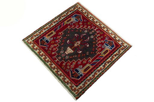 Corner detail of 2000s Shiraz rug showing border pattern and Wool pile