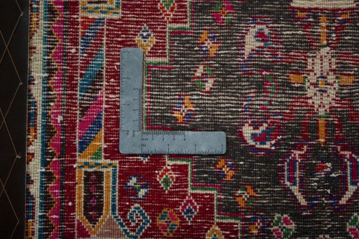 Backside of handmade 2000s Shiraz rug showing knot structure and weave density